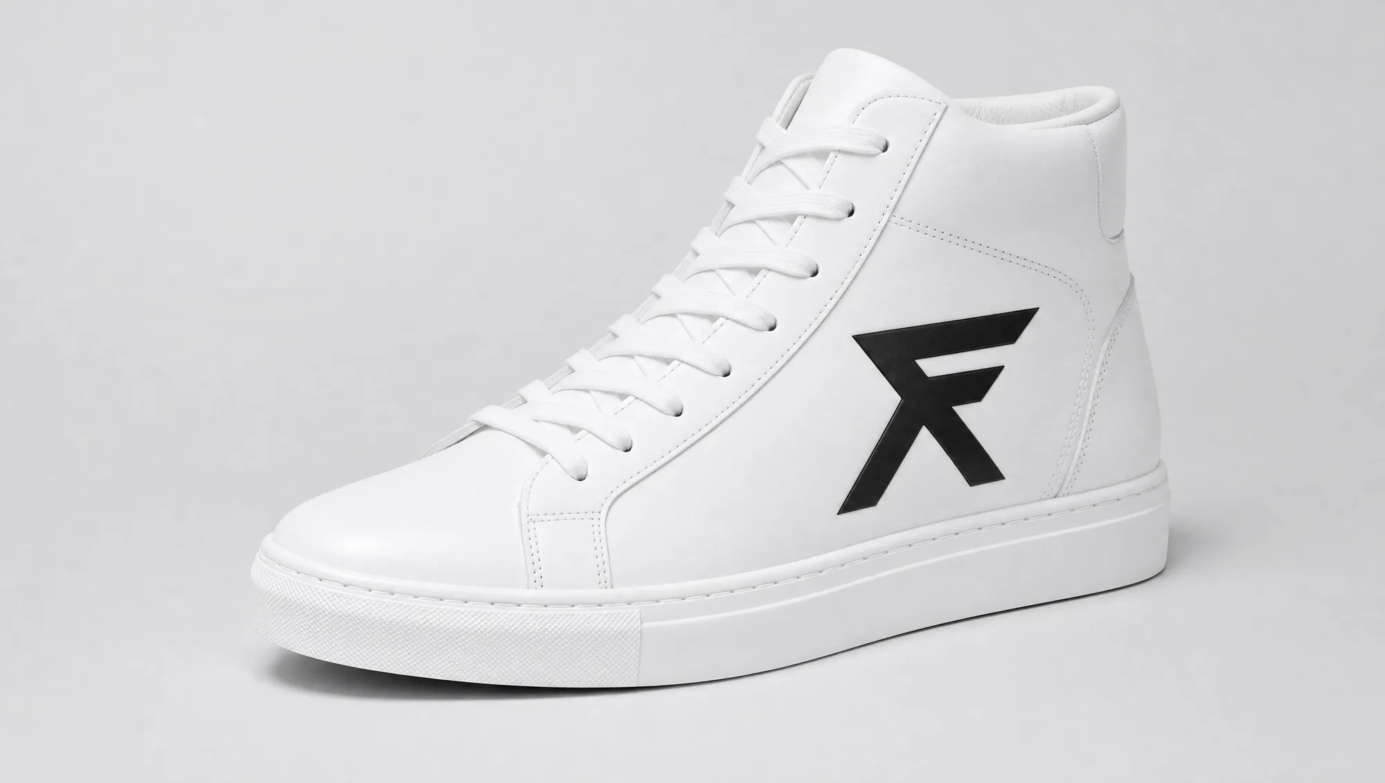 The FORMA high-top, white leather with a single black F emblem on the side panel.