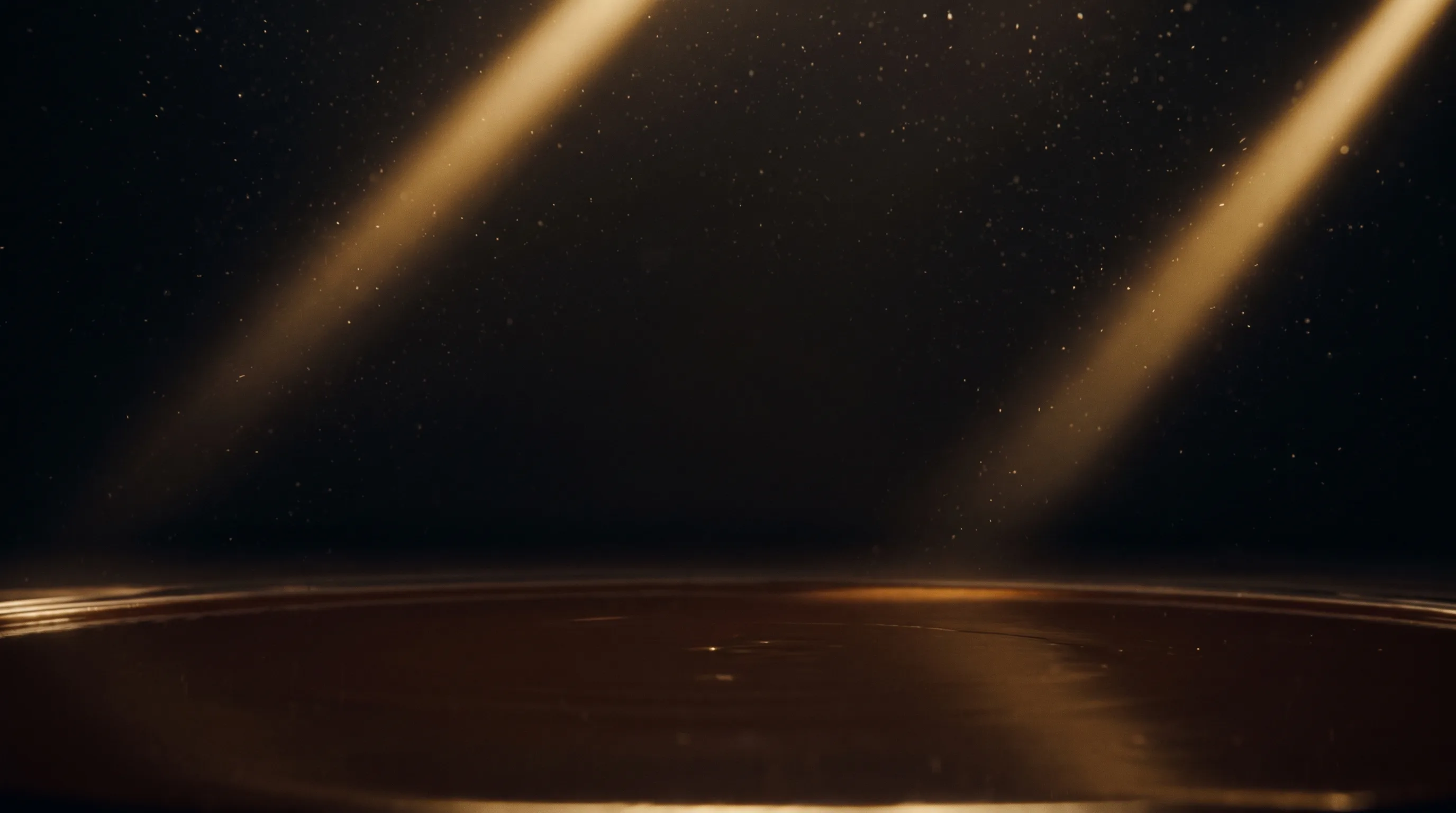 The environment plate: a black void with two gold light shafts raking down through drifting dust onto a mirror pool of molten chocolate.
